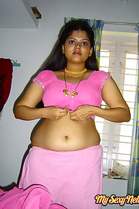 Delicious Neha bhabhi stripping her pink saree off showing pussy