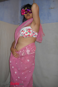 Hot Savita bhabhi unwrapping her juicy boobs from pink sari