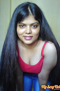 Neha bhabhi in her bedroom showing her juicy boobs