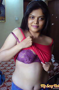 Neha bhabhi in her bedroom showing her juicy boobs