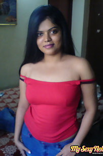 Neha bhabhi in her bedroom showing her juicy boobs