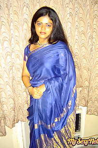 Hot and sexy Neha Nair in blue south Indian sari