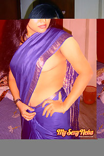 Hot and sexy Neha Nair in blue south Indian sari