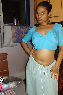 Horny Lily in blue blouse and petticoat stripping naked for fans